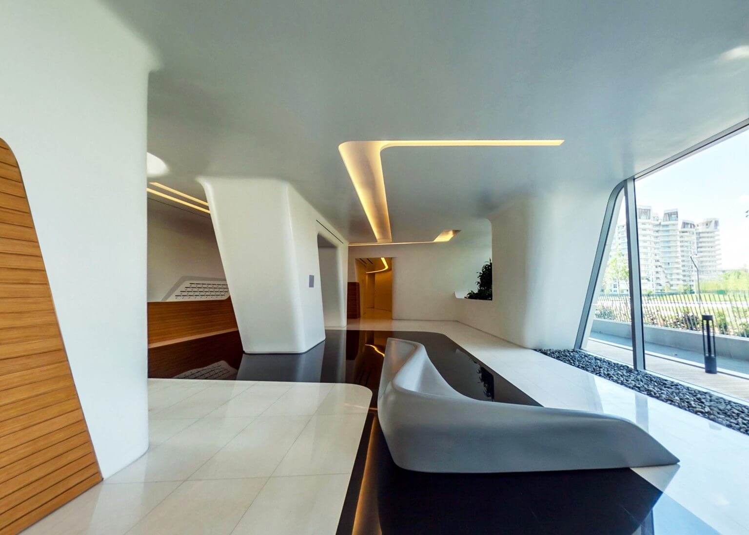 finitura interna lobby residenza Hadid City Life Milano in cartongesso e legno con velette per illuminazione e arredo